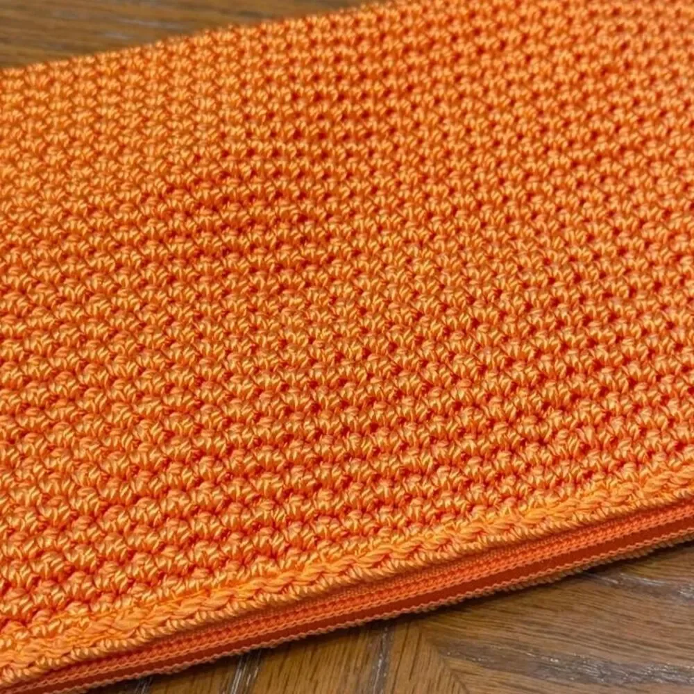 The Sak Crochet Orange Cosmetic Pouch Bag